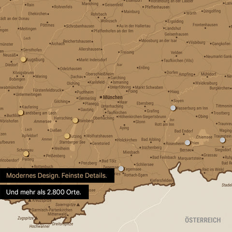 Ausschnitt einer magnetischen Deutschland-Karte in Bronze zeigt Karte von Bayern, auf der Magnete Reiseziele markieren