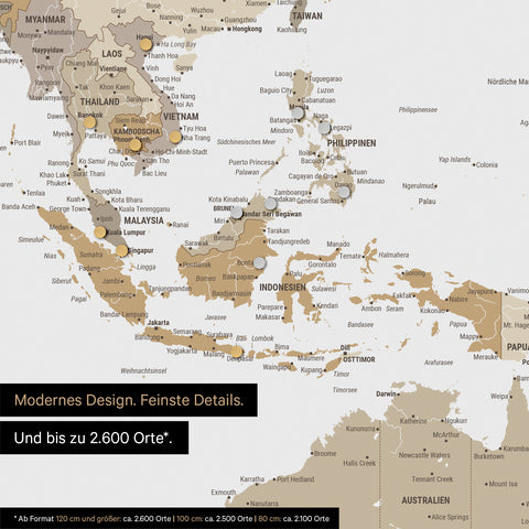 Detail van een magnetische wereldkaart in multicolor beige toont kaart van Azië, waarop magneten reisbestemmingen markeren