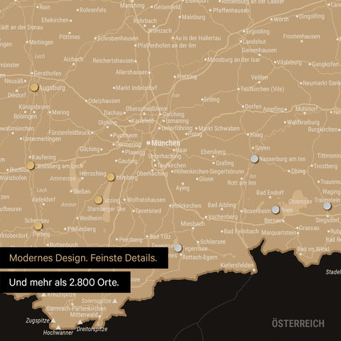 Ausschnitt einer magnetischen Deutschland-Karte in Sonar Black zeigt Karte von Bayern, auf der Magnete Reiseziele markieren