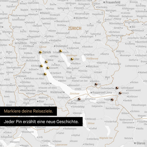 Detail einer Schweiz-Karte als Pinn-Leinwand in Dunkelgrau mit Pins rund um Zürich