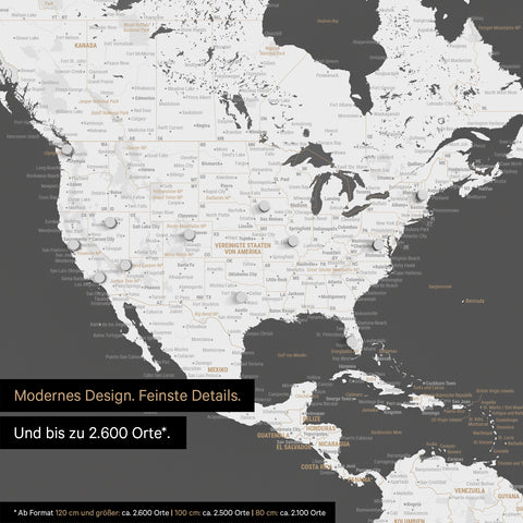 Pinnen von Reisezielen auf einer magnetischen Weltkarte als Magnetposter in Dunkelgrau